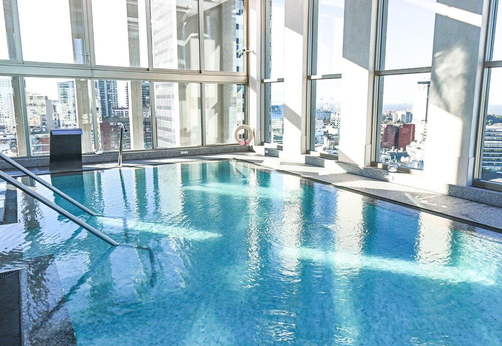 Indoor swimming pool with clear water at Alvear Art Hotel