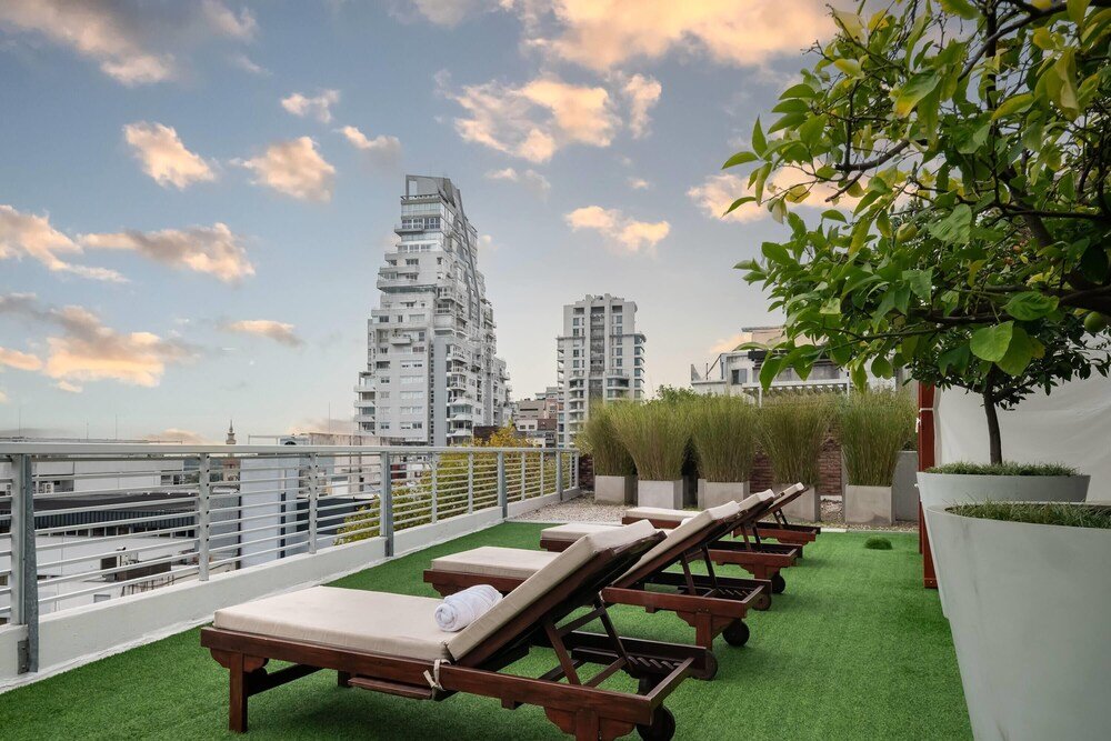 Rooftop terrace with sun loungers at Dazzler by Wyndham Polo