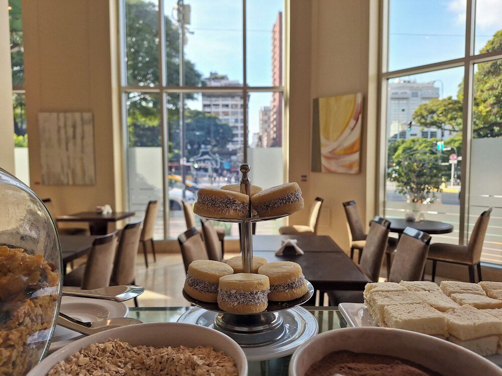 Dining area with a dessert display at Eurobuilding Hotel Boutique