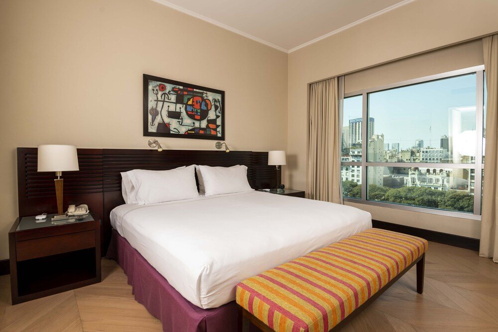 Hotel room with a large bed and two bedside tables