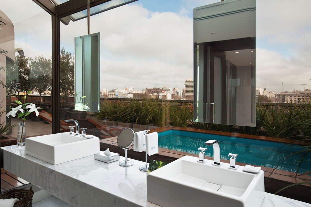 Modern bathroom with two sinks at Hotel Madero