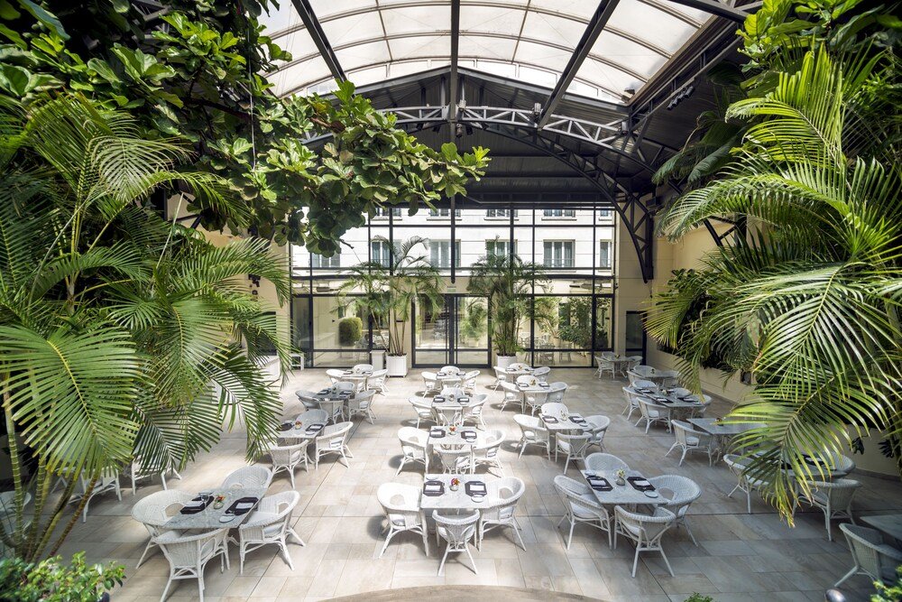 Covered outdoor seating area with white furniture