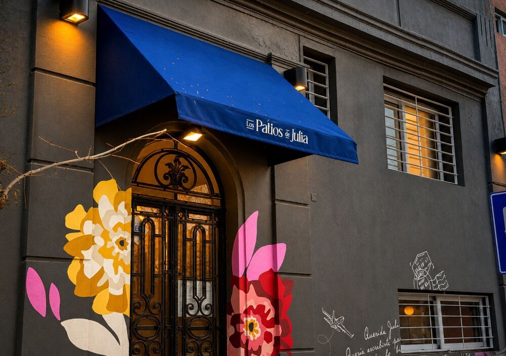 Building facade with a blue awning at Los Patios de Julia in Belgrano