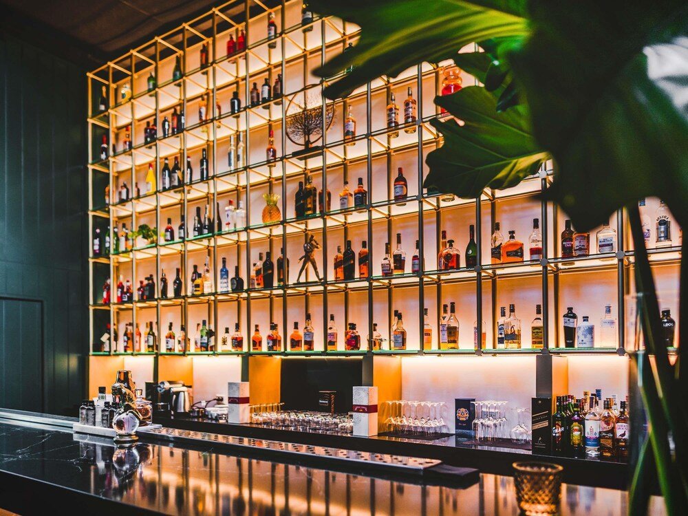 Bar area with shelves of liquor bottles